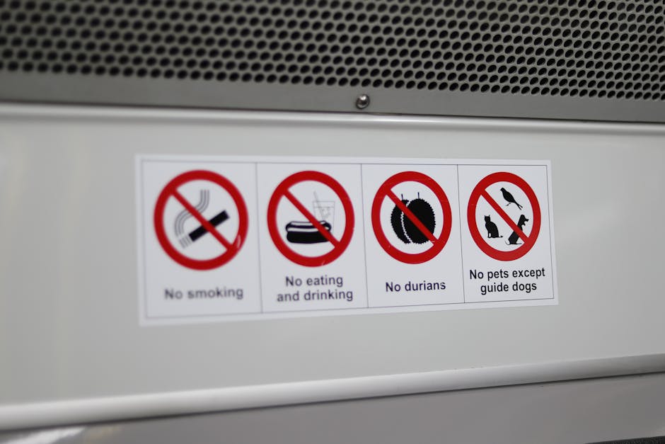 Close-up of various prohibition signs including no smoking and no durians.
